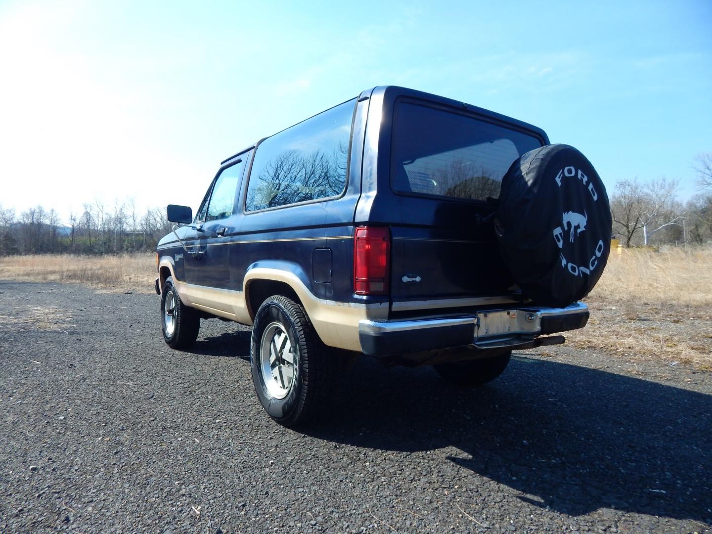 1988 Blue /Tan Ford Bronco II 4WD (1FMCU14T6JU) with an 2.9L V6 OHV 12V engine, 4-Speed Automatic Overdrive transmission, located at 6528 Lower York Road, New Hope, PA, 18938, (215) 862-9555, 40.358707, -74.977882 - Here we have a 1988 Ford Bronco 2 with a 2.9L V6 putting power to a 4x4 automatic transmission. Options include: tan cloth interior, heat/AC, XD Vision radio, power windows, cruise control, tilt steering wheel, front/rear defrost windows, spare tire cover, 15 inch alloy wheels with 4 Solarus AP tire - Photo#15